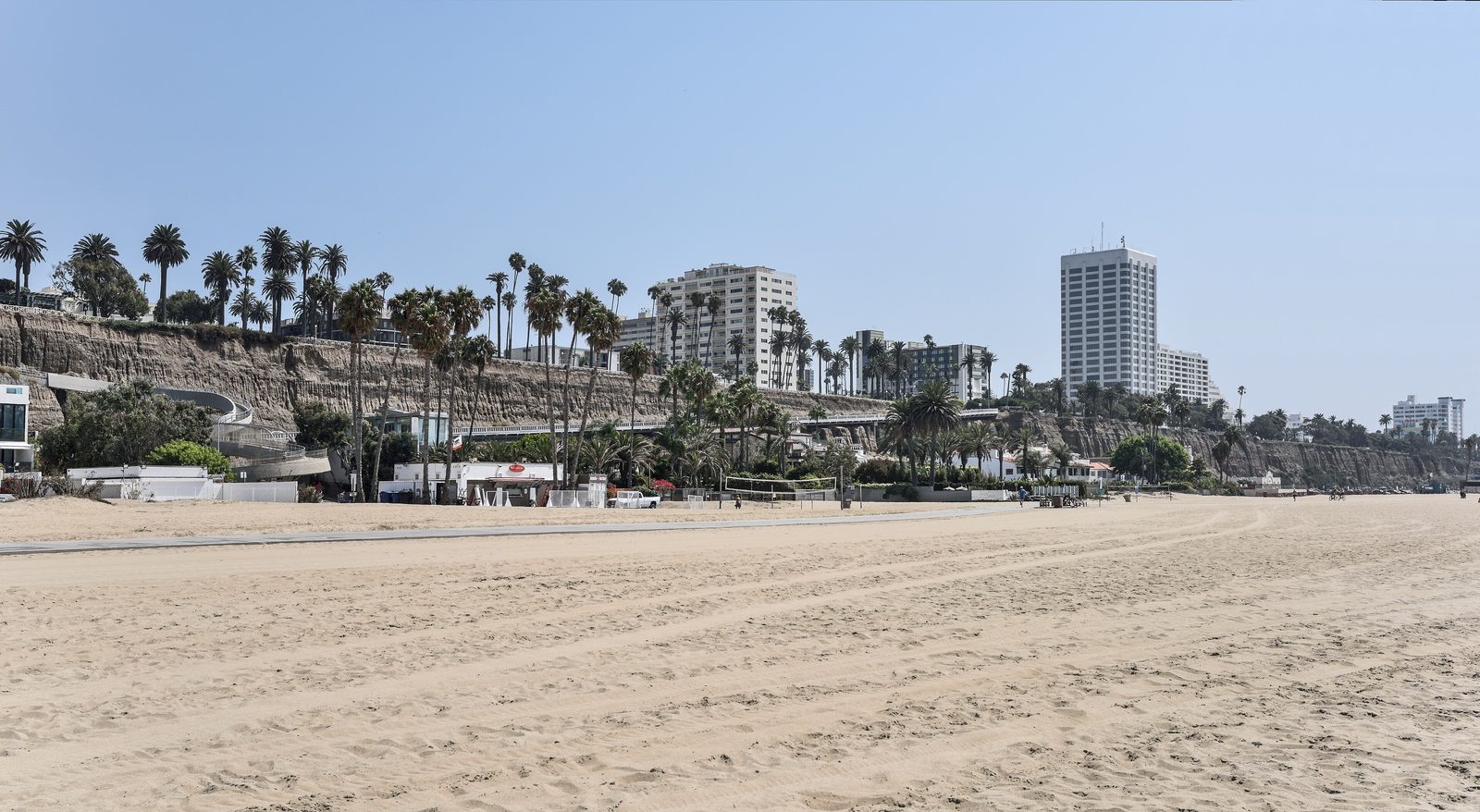 Santa Monica State Beach and the coastal sandstone bluffs, with Palisades Park along Ocean Avenue
